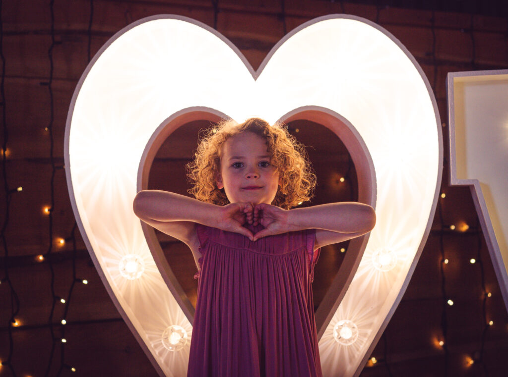 beautiful flower girl on dancefloor at wedding in cheshire