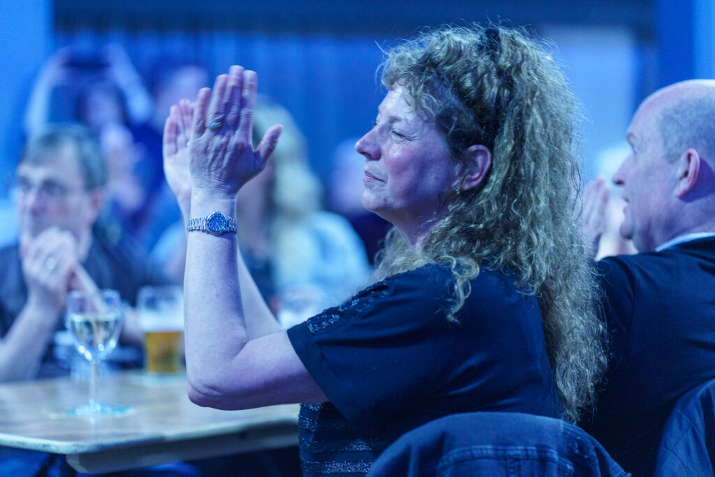 lady clapping bands at marple music night